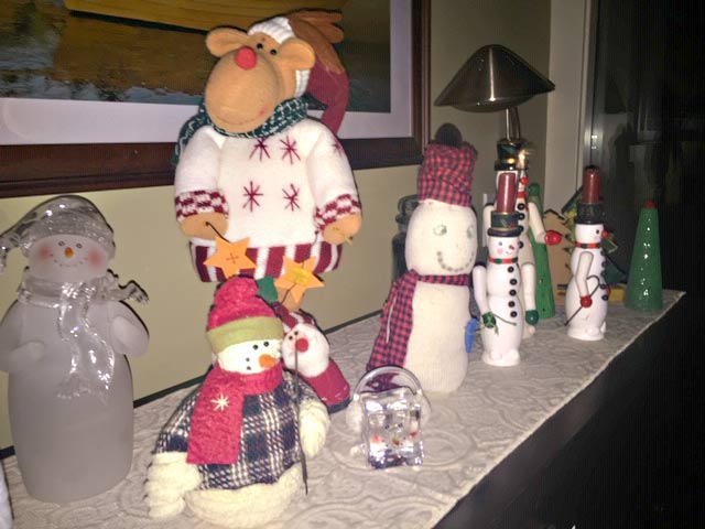 Assorted snowmen and a moose on the piano